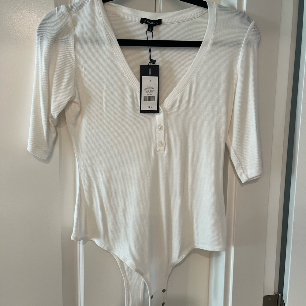 Whits short sleeved body suit